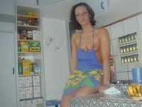 Horny housewife in the kitchen