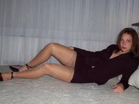 Sexy business woman sitting on a toy