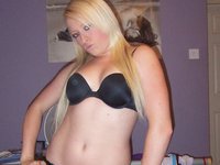 Lusty blonde posing nude