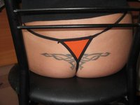 Tattoo on her ass