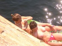 Topless babes sunbathing with pleasure