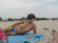 Cute naked babe on the beach
