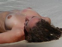 Posing nude by the ocean