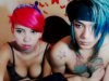 A colorful Asian couple getting naked on cam
