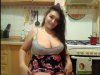 Curvy girl in the kitchen shows boobs in front of the camera