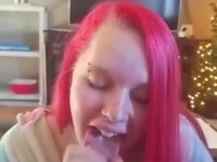 Teen with pink hair gives a blowjob