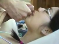 Brunette with glasses gets cum in her mouth