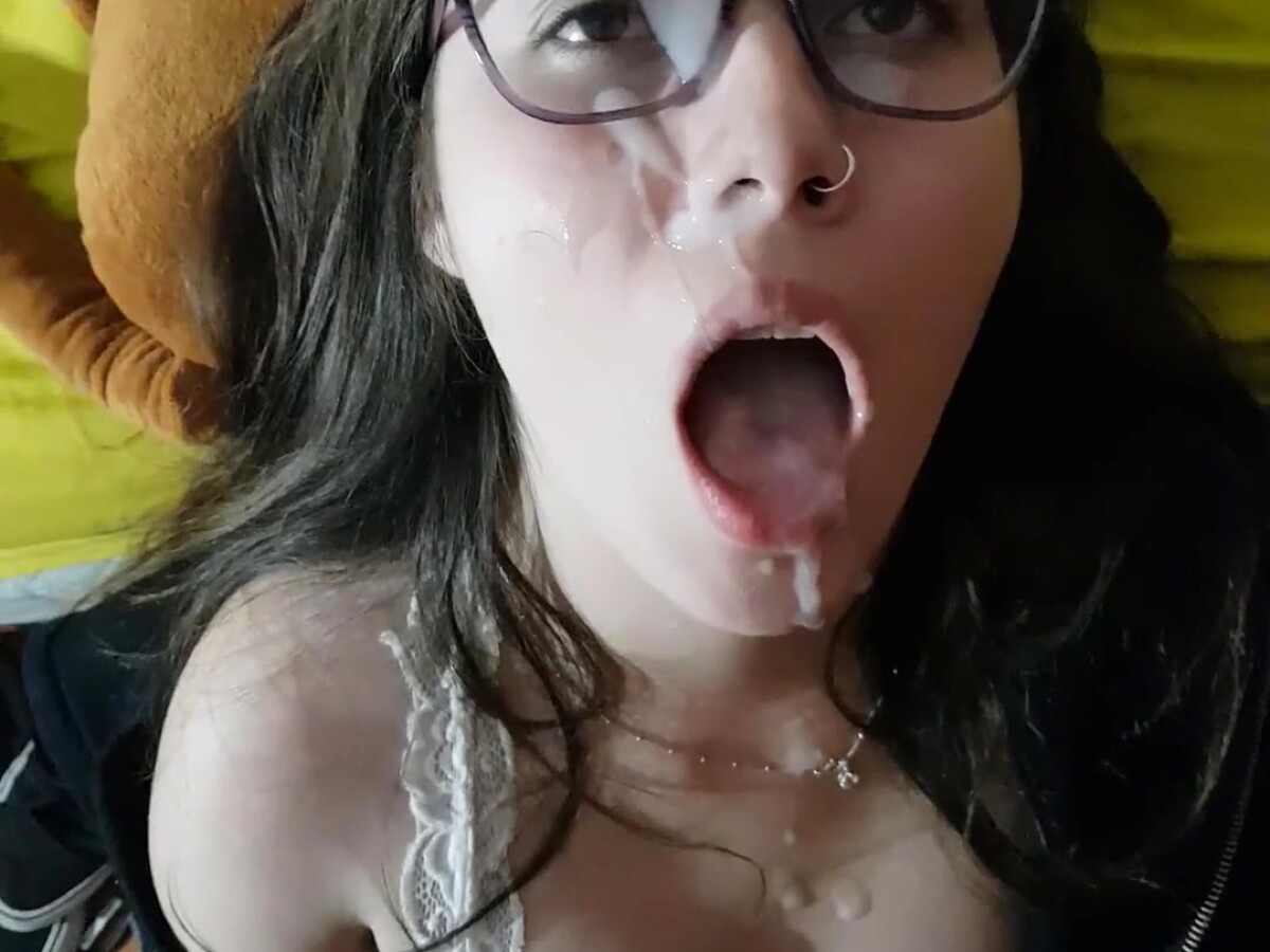 Play 'Cute brunette with glasses gets a load on her face'